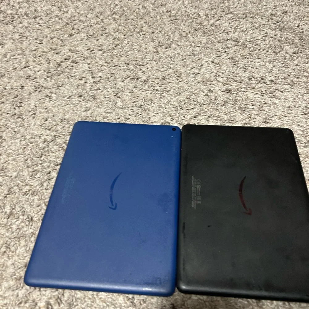 2 Amazon Fire Tablets - Black and Blue